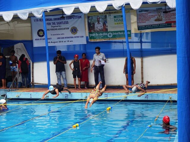 Sightless swimmers taking part in the 11th All Bengal Swimming Competition for the Blind