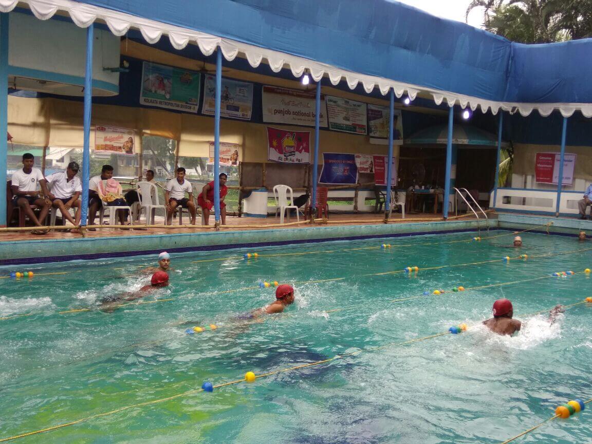Sightless swimmers in the pool at the All Bengal Swimming Competition for the Sightless, 2017
